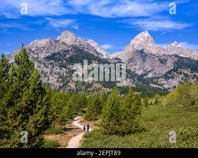 Hikers on Taggart Lake Trail in Grand Teton National Park, Wyoming. Stock Photo
