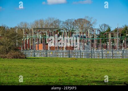 National Grid high voltage electrical sub-station in Mill Hill, London, surrounded by Mill Hill Substation Pastures a nature reserve. UK. Stock Photo