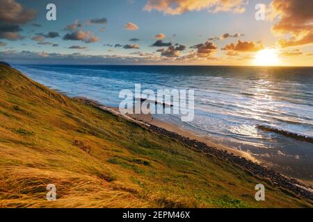 sunset at coast in Lønstrup, Danmark; Lonstrup, Denmark Stock Photo