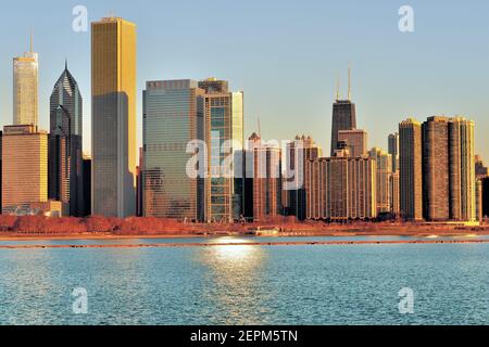 Chicago, Illinois, USA. A segment of the Chicago skyline illuminated by a sunrise on late winter morning. Stock Photo