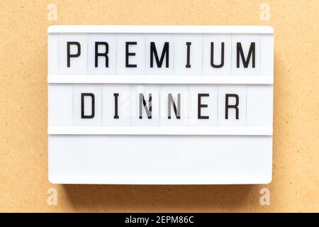 Lightbox with word premium dinner on wood background Stock Photo