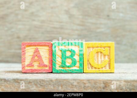 Color alphabet letter block in word abc on wood background Stock Photo