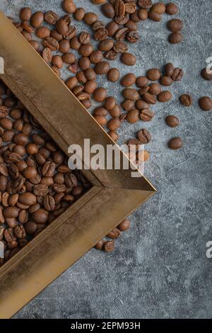 Coffee beans with empty frame on a marble background Stock Photo
