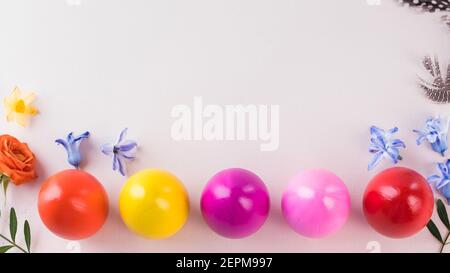 Colorful Easter eggs on a pink background. Bright Easter concept. Copy space. Stock Photo