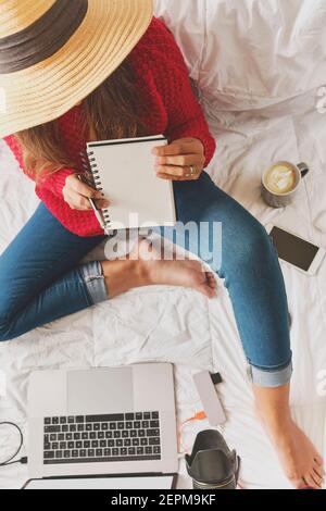 Young Caucasian teacher or tutor. Smart female students online digital education course or lesson. Concept creative work at home. Selective focus. Stock Photo