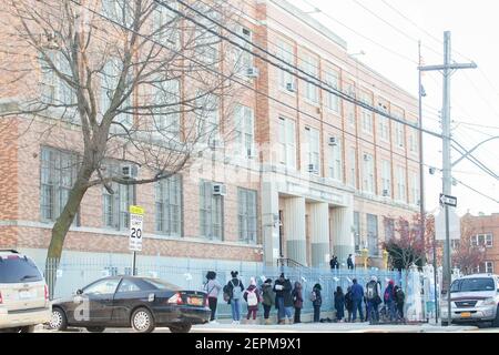 February 24, 2021, New York, NY, USA: February 25, 2021 :  Students wait to check in at the Leaders Of Tomorrow Middle School  at 3710 Barnes Ave. in the Bronx on its day of re-opening (Credit Image: © Dan Herrick/ZUMA Wire) Stock Photo