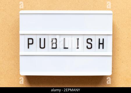 Lightbox with word publish on wood background Stock Photo