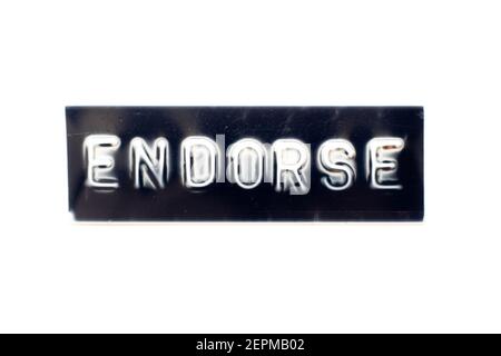 Embossed letter in word endorse on black banner with white background Stock Photo
