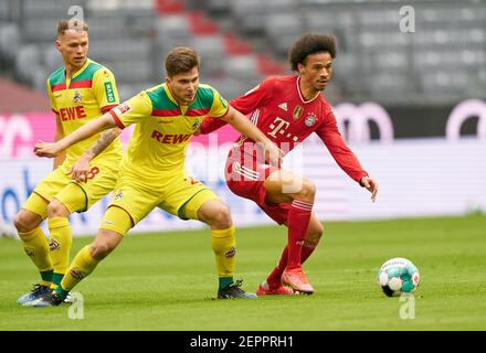 Munich, Germany. 27th February, 2021. Leroy SANE, FCB 10  compete for the ball, tackling, duel, header, zweikampf, action, fight against Elvis REXHBECAJ, 1.FCK 20  in the match FC BAYERN MUENCHEN - 1.FC KOELN 1.German Football League on February 27, 2021 in Munich, Germany  Season 2020/2021, matchday 23, 1.Bundesliga, FCB, München, 23.Spieltag, Köln. © Peter Schatz / Alamy Live News    - DFL REGULATIONS PROHIBIT ANY USE OF PHOTOGRAPHS as IMAGE SEQUENCES and/or QUASI-VIDEO - Stock Photo