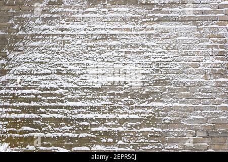 Stunning textured effect on the wall of a house, caused by blowing snow during a blizzard Stock Photo