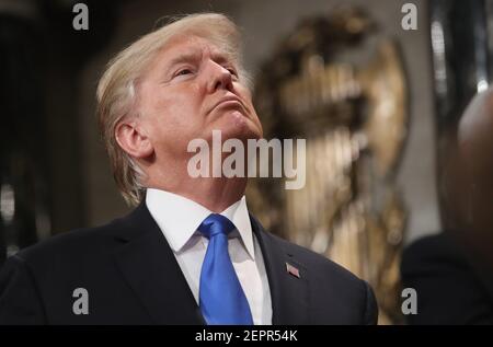 WASHINGTON, DC - JANUARY 30: U.S. President Donald J. Trump signs a hat after finishing the State of the Union address in the chamber of the U.S. House of Representatives January 30, 2018 in Washington, DC. This is the first State of the Union address given by U.S. President Donald Trump and his second joint-session address to Congress. (Photo by Win McNamee/Pool/Sipa USA)