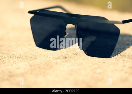 Black Oversized sunglasses shoot in a summer day closeup. Selective focus Stock Photo