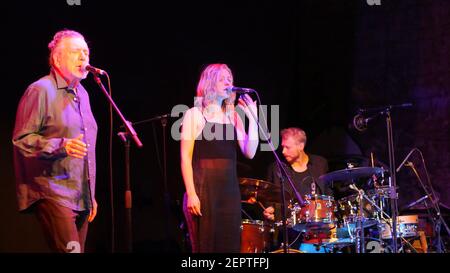 Robert Plant Performing Live on Stage with Saving Grace Band, Talented Musicians Suzy Dian, and Oli Jefferson at Summer Music Festival Gig in UK Stock Photo