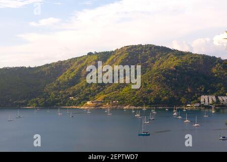 Yachts with lowered sails are in the bay. Thailand. Stock Photo