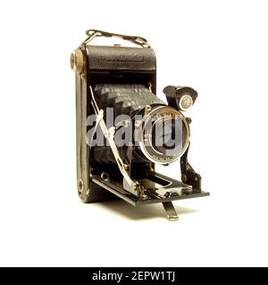 The vintage camera is displayed prominently against a clean background, highlighting its design and detailed mechanics Stock Photo