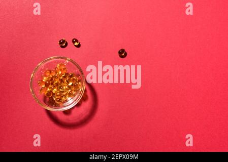 Oil filled capsules (softgel) of food supplements: fish oil, omega 3, omega 6, omega 9, vitamin A, vitamin D3, vitamin E, evening primrose oil, borage Stock Photo