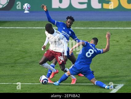 Arsenal's Nicolas Pepe (left) is fouled by Leicester City's Wilfred Ndidi (centre) resulting in a free-kick just outside the box following a VAR review during the Premier League match at the King Power Stadium, Leicester. Picture date: Sunday February 28, 2021. Stock Photo