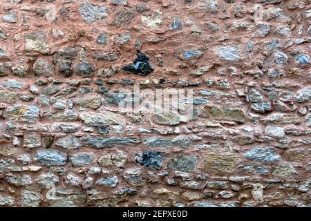 Irregular stone wall texture background photo Stock Photo