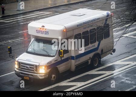 https://l450v.alamy.com/450v/2epy6md/an-access-a-ride-vehicle-waits-for-their-passenger-during-inclement-weather-in-the-chelsea-neighborhood-of-new-york-on-thursday-february-22-2018-according-to-a-recently-released-audit-by-the-new-york-city-comptrollers-office-almost-half-of-complaints-by-users-about-access-a-ride-are-either-ignored-or-only-investigated-cursorily-access-a-ride-a-unit-of-the-mta-provides-transportation-services-to-the-disabled-and-elderly-who-cannot-use-the-subway-or-bus-system-photo-by-richard-b-levine-2epy6md.jpg