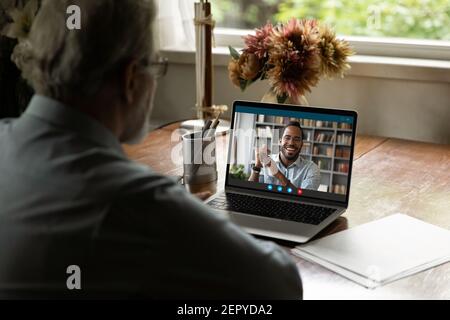 Screen view of happy black young man talking to father Stock Photo