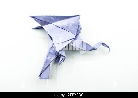 Gray origami eagle isolated on white background.Beautiful paper craft. Stock Photo