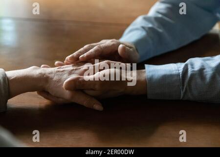 Senior adult husband consoling middle aged wife Stock Photo