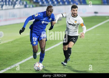 Allan Nyom of Getafe and Jose Gaya of Valencia during the Spanich championship La Liga football match between Getafe CF and Valencia CF on February 27, 2021 at Coliseum Alfonso Perez in Getafe, Madrid, Spain - Photo Irina R Hipolito / Spain DPPI / DPPI / LiveMedia Stock Photo