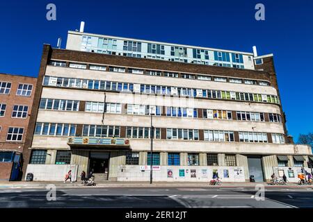 Exterior of 1930s art deco style Olympic Park campus of Global Banking School (GBS) (formelry Poplar Town Hall) on Bow Road, Tower Hamlets, London, UK Stock Photo