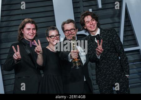 Gulliver Flynn Oldman, Gisele Schmidt, Gary Oldman and Charlie John