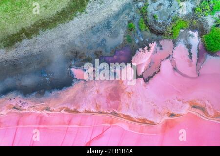 White salt on the shores of the island in Pink Island. Lake Lemuria, Ukraine. Stock Photo