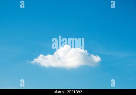Cute fluffy shape single cloud on clear blue sky background. Stock Photo