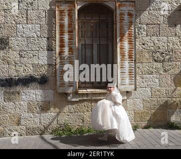 Jerusalem, Israel. 28th Feb, 2021. An Ultra-Orthodox Jewish girl wears a costume to celebrate Purim in Mea Shearim in Jerusalem, on Sunday, March 28, 2021. Photo by Debbie Hill/UPI Credit: UPI/Alamy Live News Stock Photo