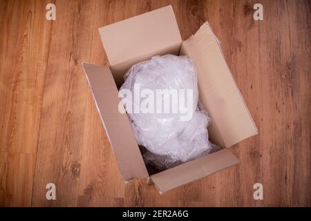 High angle view of opened box on floor Stock Photo