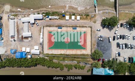 Aerial top view of soccer football or basketball courts in the island at Phangnga Thailand. Stock Photo