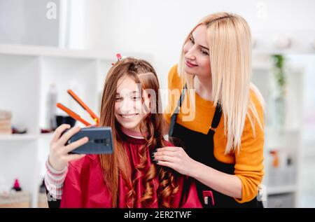 Hairdresser and model making selfie Stock Photo