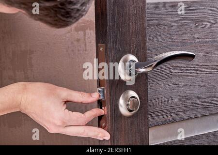 person fixing door furniture. improvement process Stock Photo