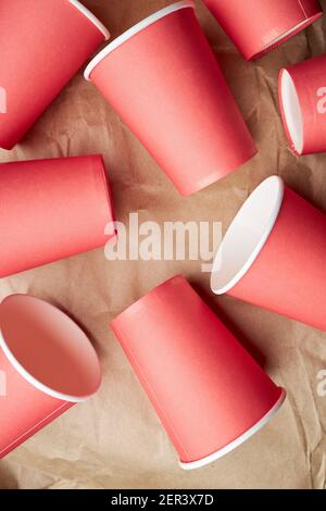 pile of disposable red paper cups on paper background. eco friendly concept. look from above. background backdrop Stock Photo