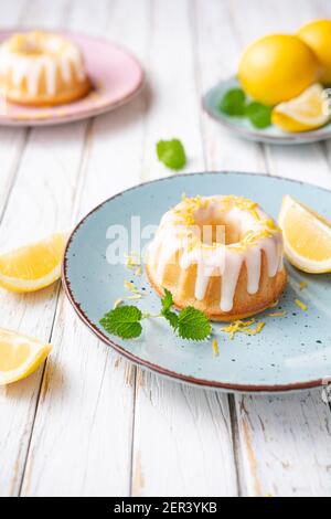 Tangy mini lemon bundt cakes topped with lemon glaze Stock Photo