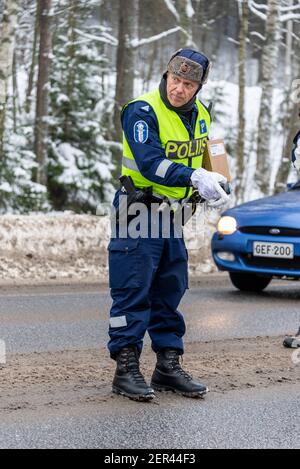 Finnish Police officers breathalysing drivers at random on a main road in north Finland Stock Photo