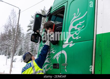 Finnish Police officers breathalysing drivers at random on a main road in north Finland Stock Photo