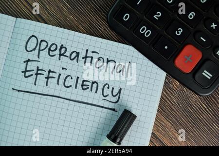 Operational Efficiency write on a book isolated on Wooden Table. Stock Photo
