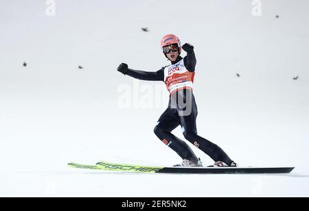 Karl Geiger from Germany celebrates his third position in the FIS World ...