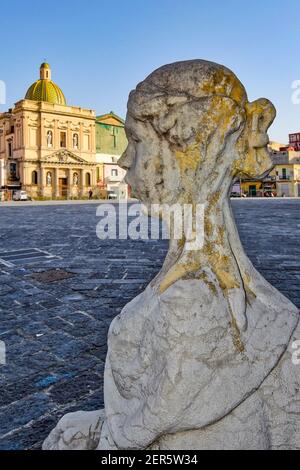 The head of an ornamental statue of a fountain in the old city of Naples, Italy. Stock Photo