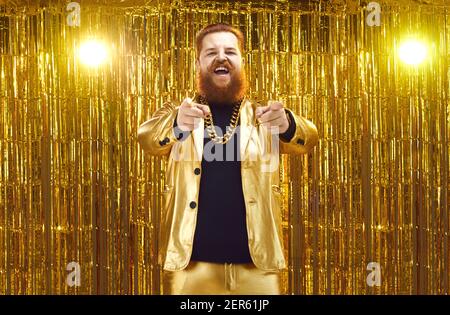 Funny positive overweight man hipster pointing with fingers at camera Stock Photo