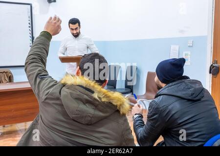Doctor at university explaining stuff to students Stock Photo