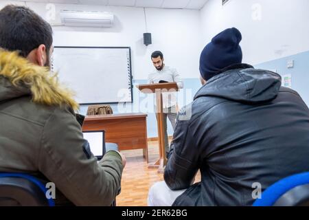 Doctor at university explaining stuff to students Stock Photo