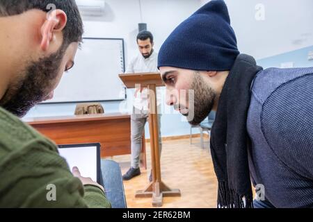 Arabic students discussing things in class Stock Photo