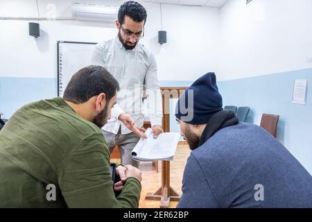 Arabic students discussing things in class Stock Photo