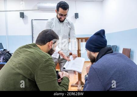 Arabic students discussing things in class Stock Photo