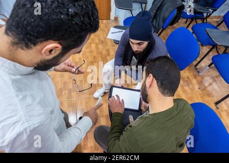 Arabic students discussing things in class Stock Photo